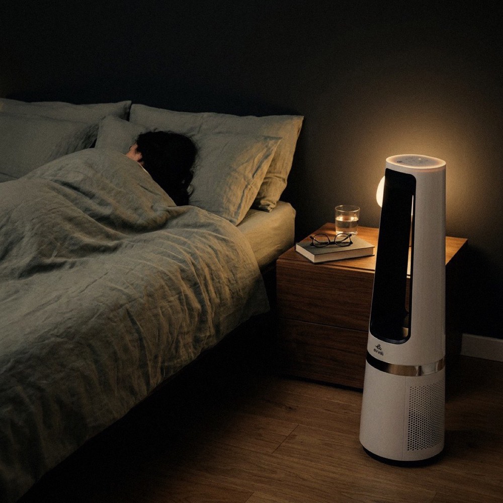 The evvoli tower on low beside the bed at night