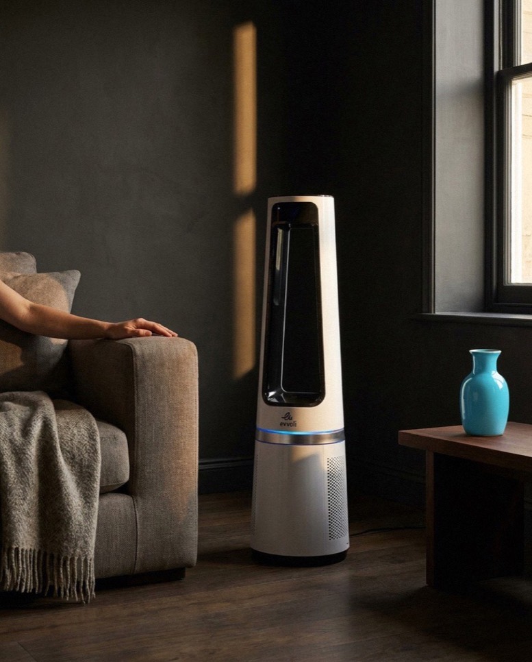 The evvoli bladeless fan beside a linen sofa